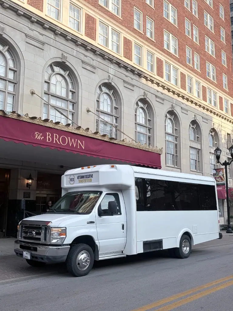 White VET shuttle bus at the Brown Hotel in Louisville