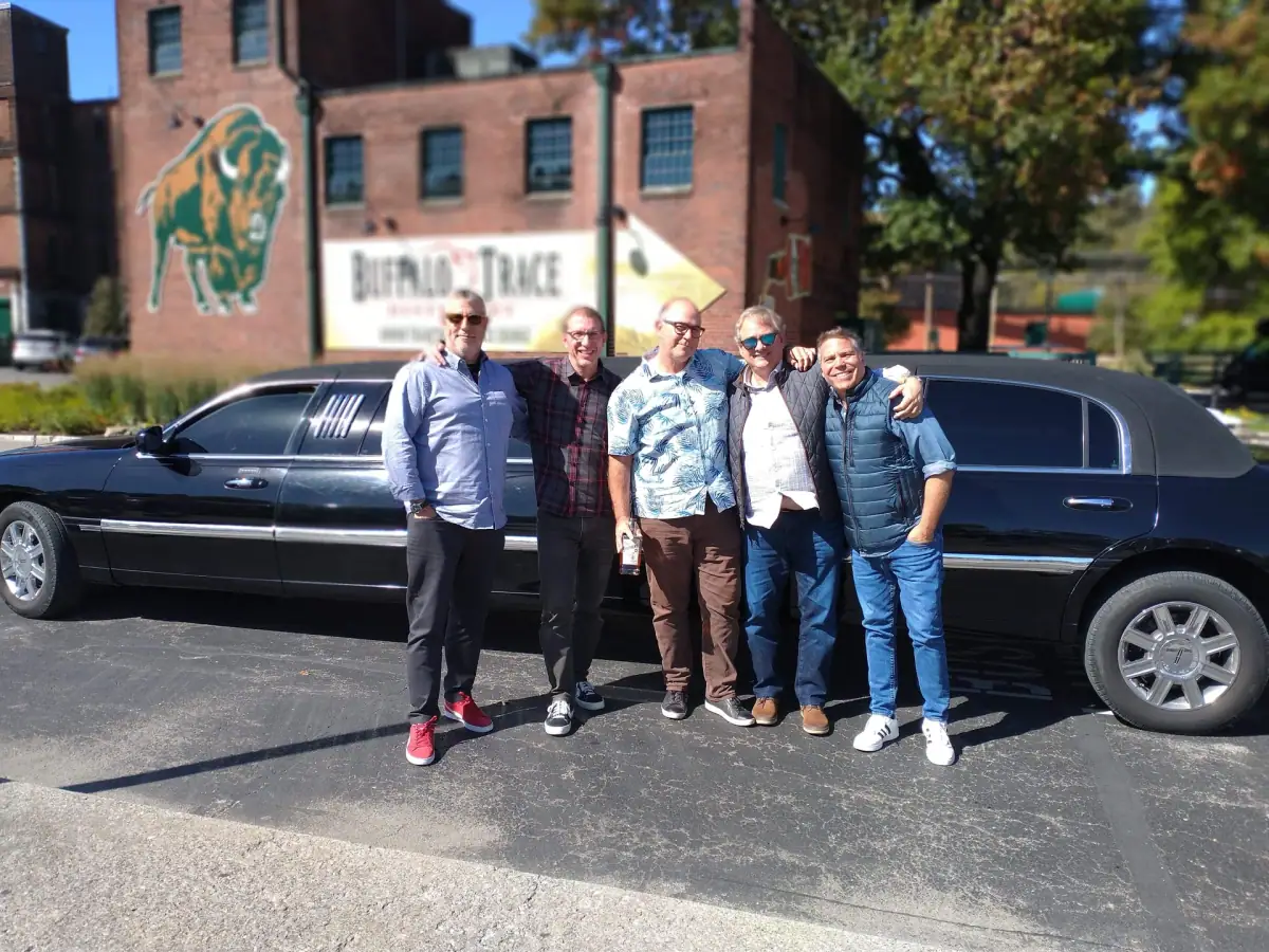 Group beside a stretch limousine at Buffalo Trace Distillery