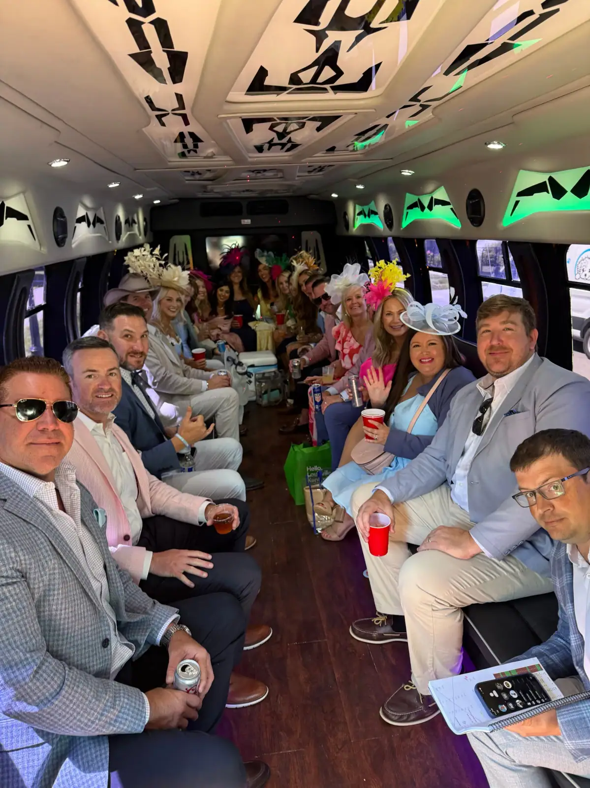 Colored lighting and leather seats inside a party bus