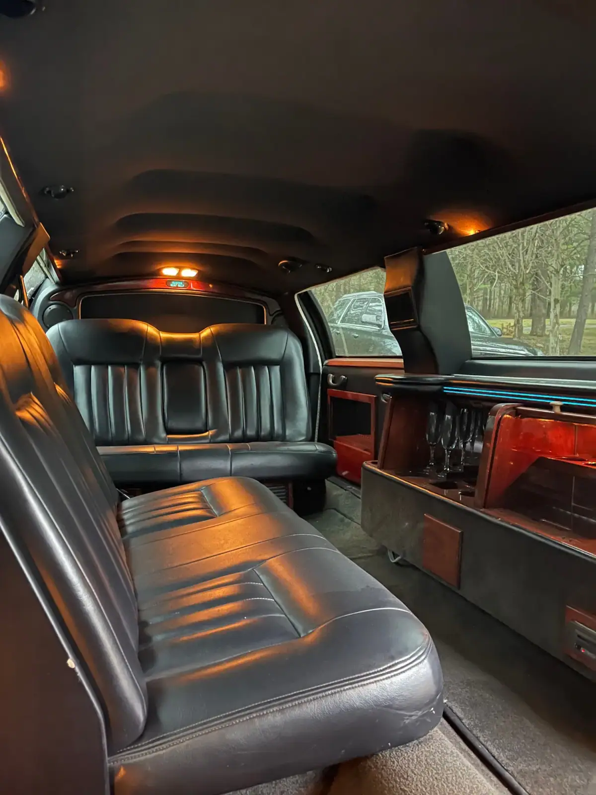 Rear bench and bar inside a stretch limousine