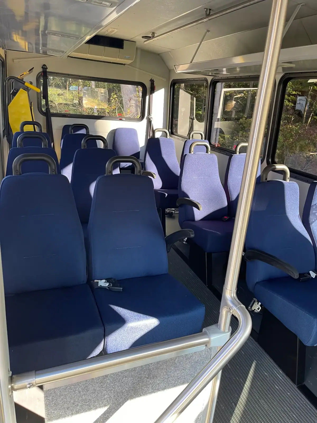 Leather captain's chairs inside a shuttle bus